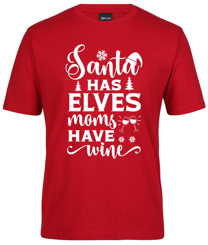 The Santa has elves moms have Wine Shirt by Corsa Clothing is a red tee featuring white text, snowflakes, Christmas trees, a Santa hat, and two clinking wine glasses.