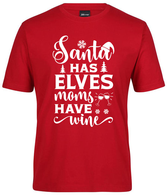 The Santa has elves moms have Wine Shirt by Corsa Clothing is a red tee featuring white text, snowflakes, Christmas trees, a Santa hat, and two clinking wine glasses.