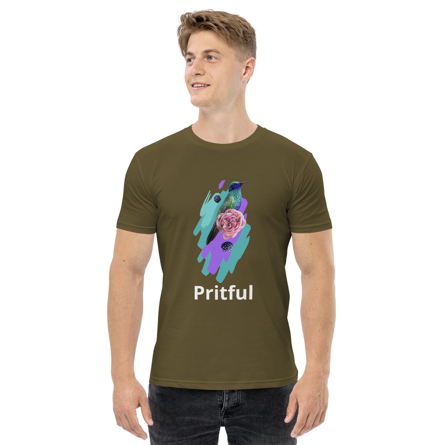A smiling man wears an olive green Corsa Clothing men's staple tee featuring a colorful hummingbird, butterfly, and pink rose. "Pritful" appears in white below the design. This shirt is popular in Australia and New Zealand.