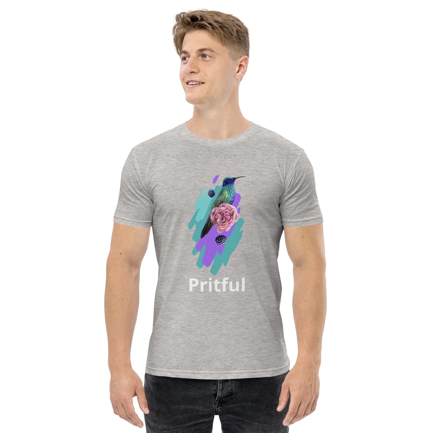 A smiling man wears a light gray Men's staple tee from Corsa Clothing, featuring a colorful hummingbird, pink rose, leaves graphic, and "Pritful"—perfect for cotton t-shirt lovers in Australia and New Zealand.