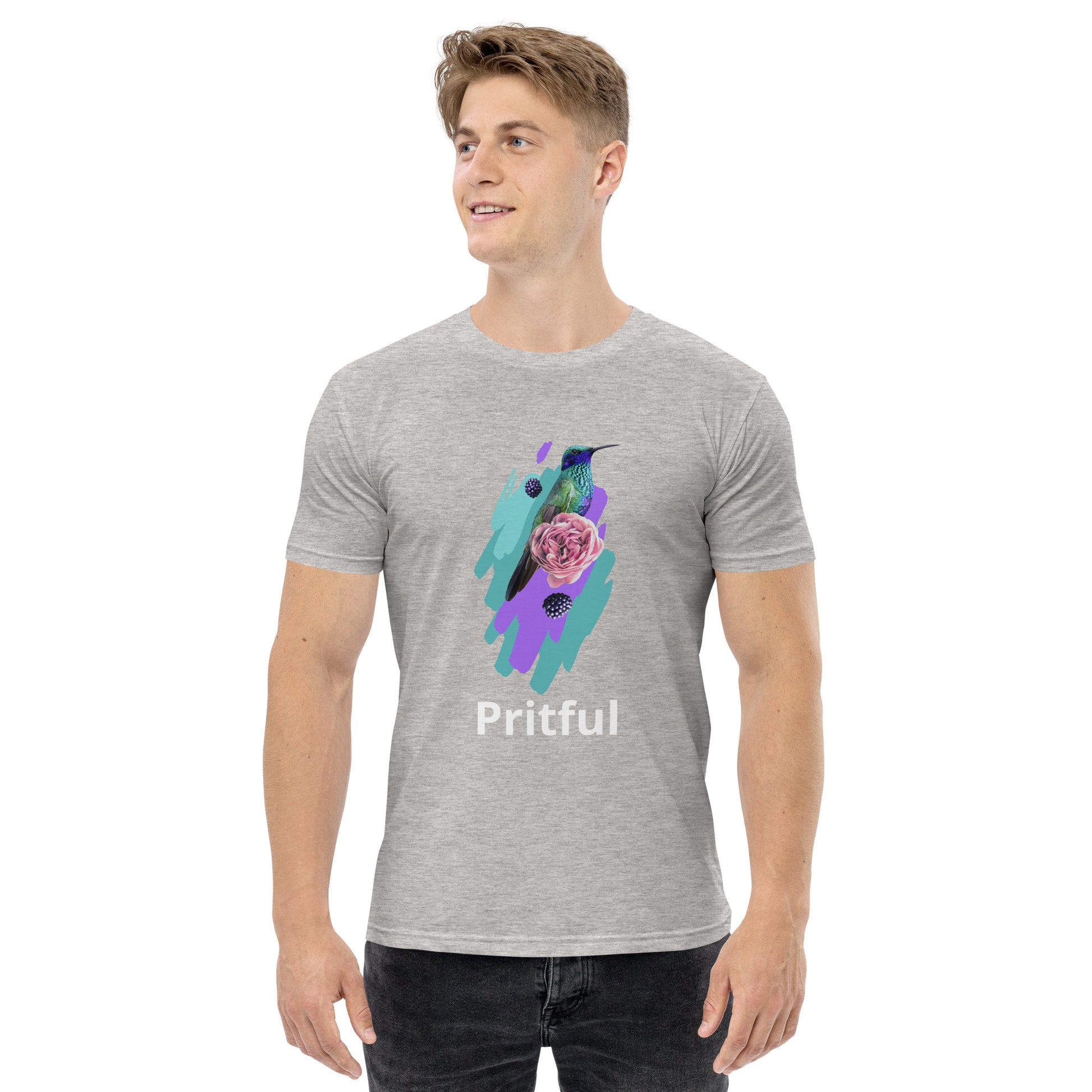 A smiling man wears a light gray Men's staple tee from Corsa Clothing, featuring a colorful hummingbird, pink rose, leaves graphic, and "Pritful"—perfect for cotton t-shirt lovers in Australia and New Zealand.