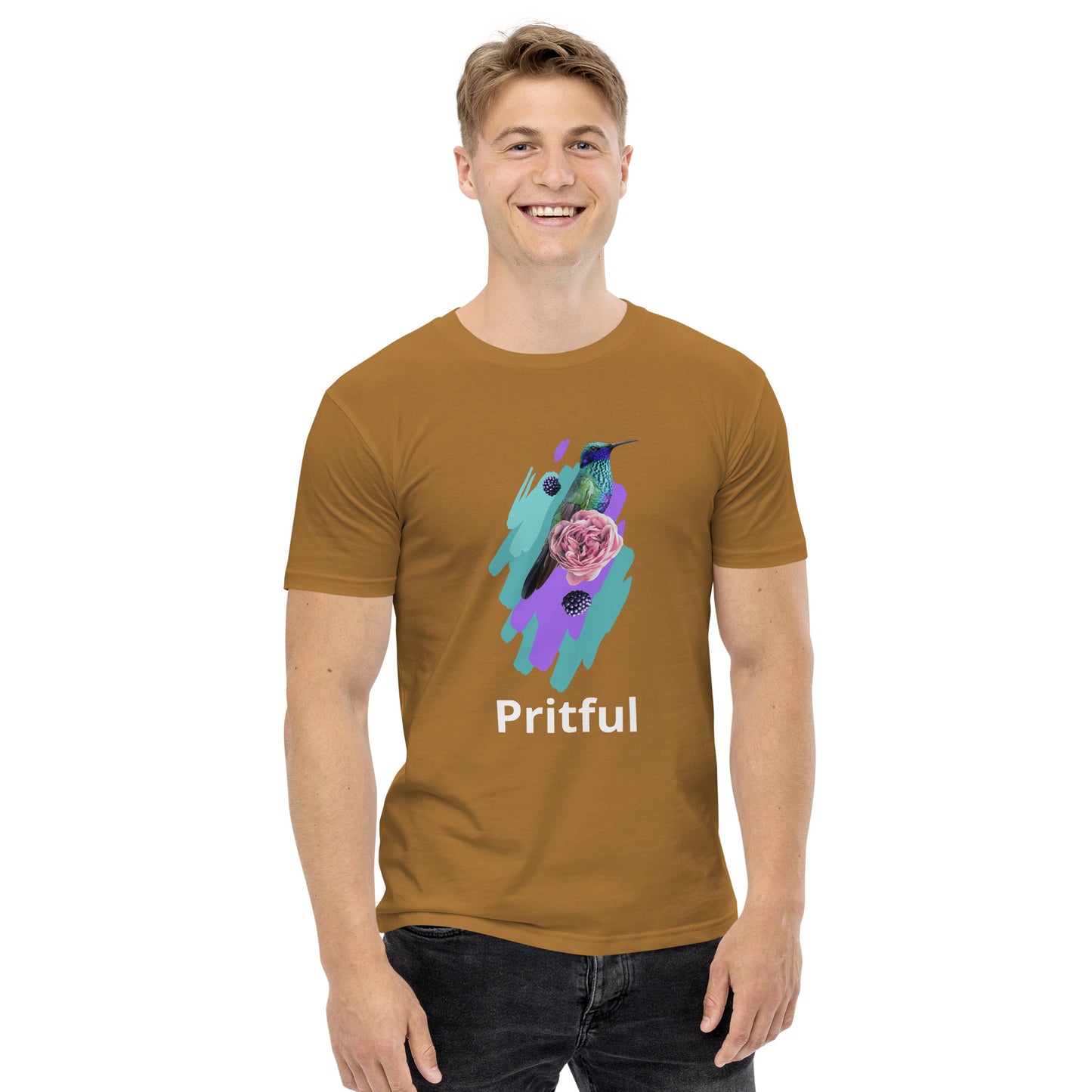 A smiling person wears the Corsa Clothing Men's staple tee, featuring a hummingbird, purple rose, and blue-green brushstrokes with "Pritful" below—printed on soft cotton and popular in Australia and New Zealand.