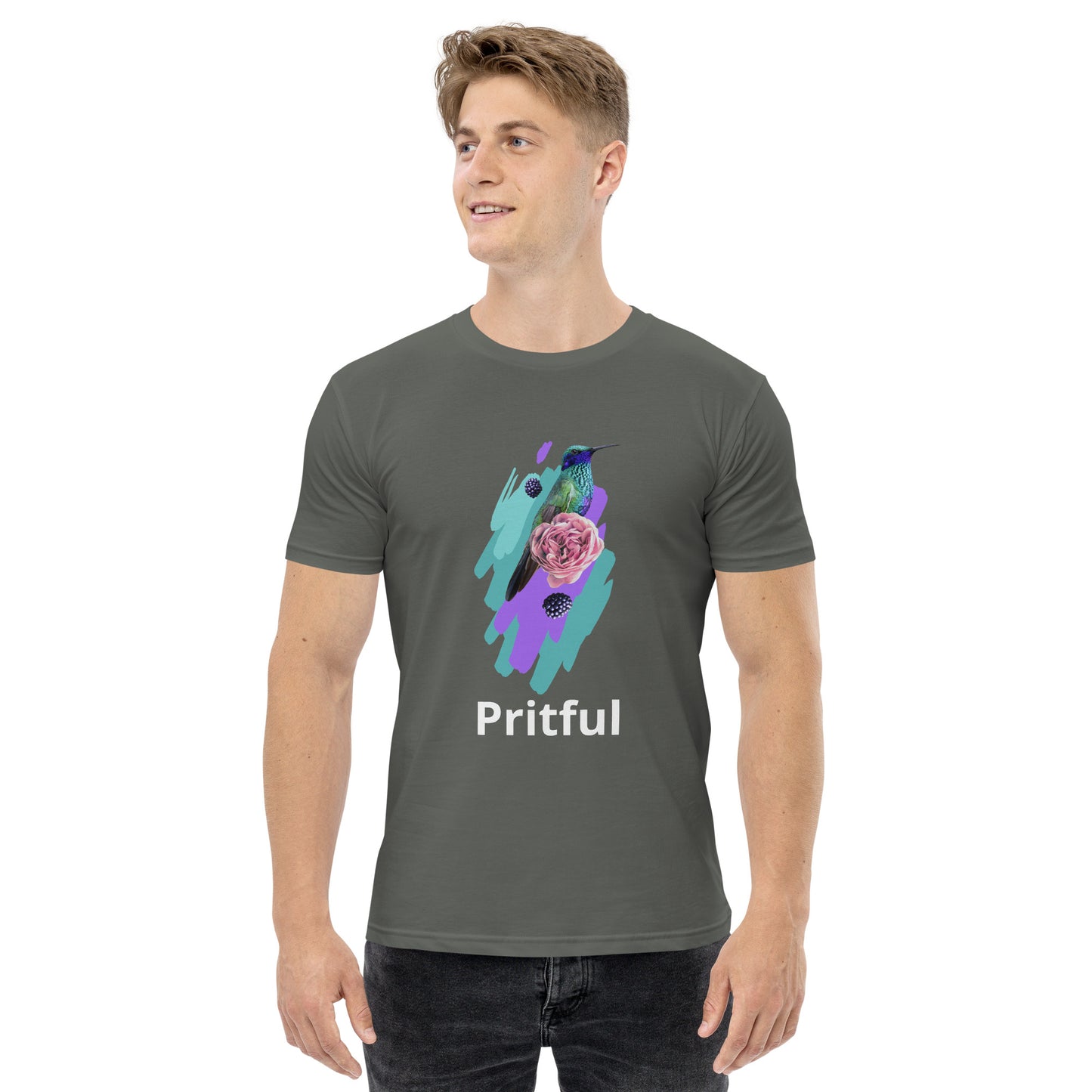 A young man wears the Corsa Clothing Men's staple tee—a gray cotton shirt featuring a colorful hummingbird, pink flower, purple brushstrokes, and "Pritful" below the artwork. He smiles and looks to the side. Popular in Australia and New Zealand.