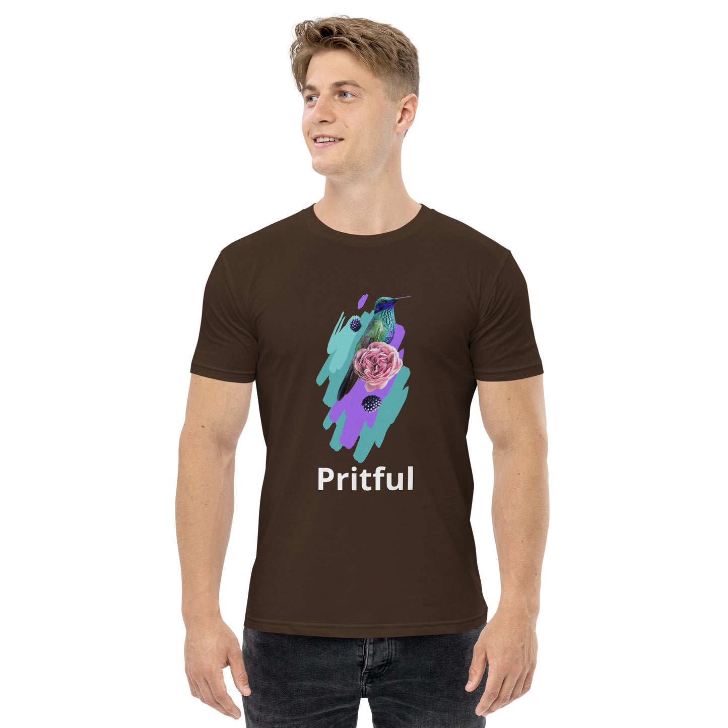 A smiling man wears a dark brown cotton Corsa Clothing Men’s staple tee with a hummingbird, pink rose, and vibrant paint strokes—an eye-catching favorite in Australia and New Zealand.