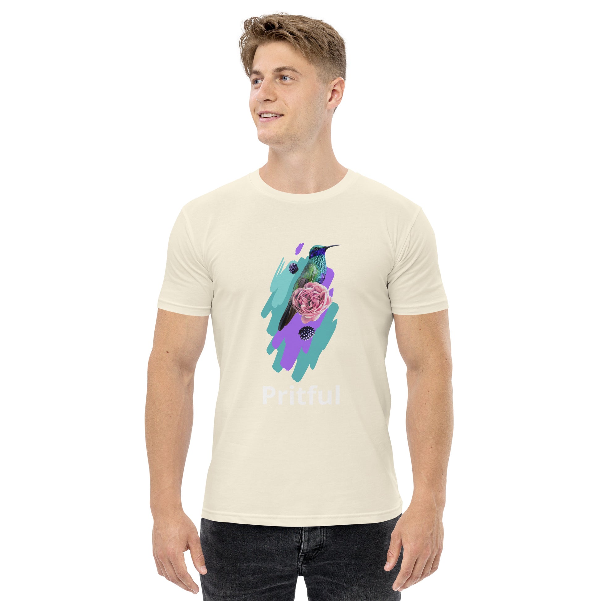 A smiling man wears the Men's Staple Tee by Corsa Clothing, featuring a colorful hummingbird and pink rose on an abstract purple and teal background with "Pritful" below—perfect cotton style for Australia and New Zealand lovers.