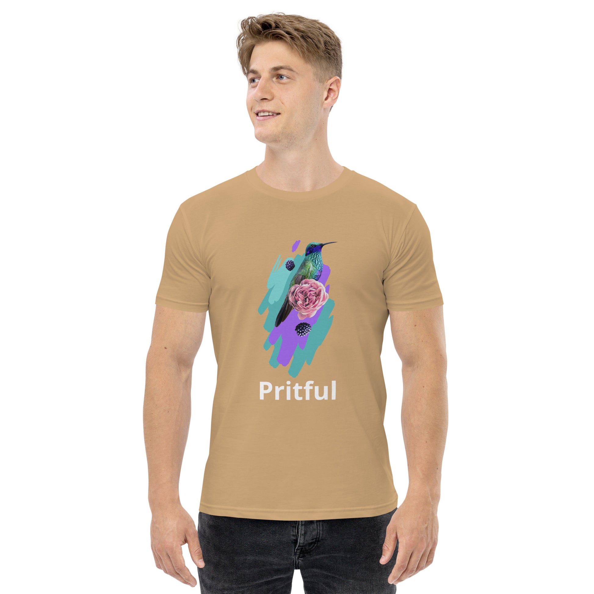 A smiling man wears the Men's staple tee by Corsa Clothing in beige, featuring a vibrant hummingbird and pink flower with "Pritful" below. Made from soft cotton, this tee is ideal for Australia and New Zealand style lovers.
