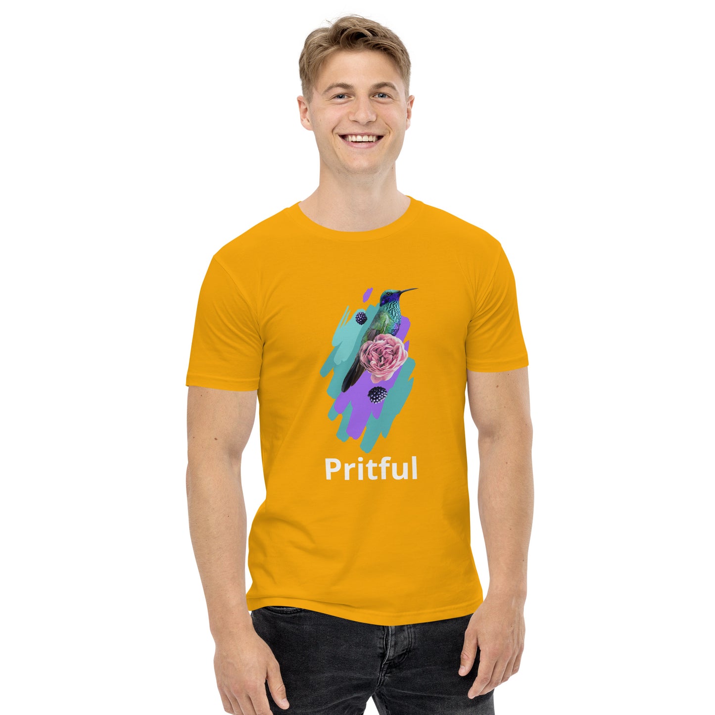 A smiling person wears the Corsa Clothing men's staple tee in bright yellow, featuring a colorful bird, purple flower, blue/purple brushstrokes, and "Pritful" below the graphic—ideal cotton t-shirt for Australia and New Zealand.