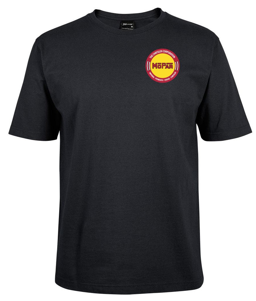 A plain black t-shirt by Corsa Clothing with The Chrysler Corp. MOPAR pocket design, featuring a small circular logo on the left chest with yellow and red elements and MGPAF text in the center.