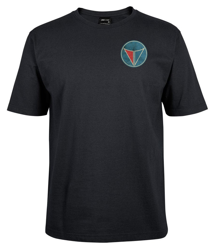 The Corsa Clothing Valiant round blue/red pocket is a black short-sleeve t-shirt with a small, circular blue and red geometric logo on the left chest.